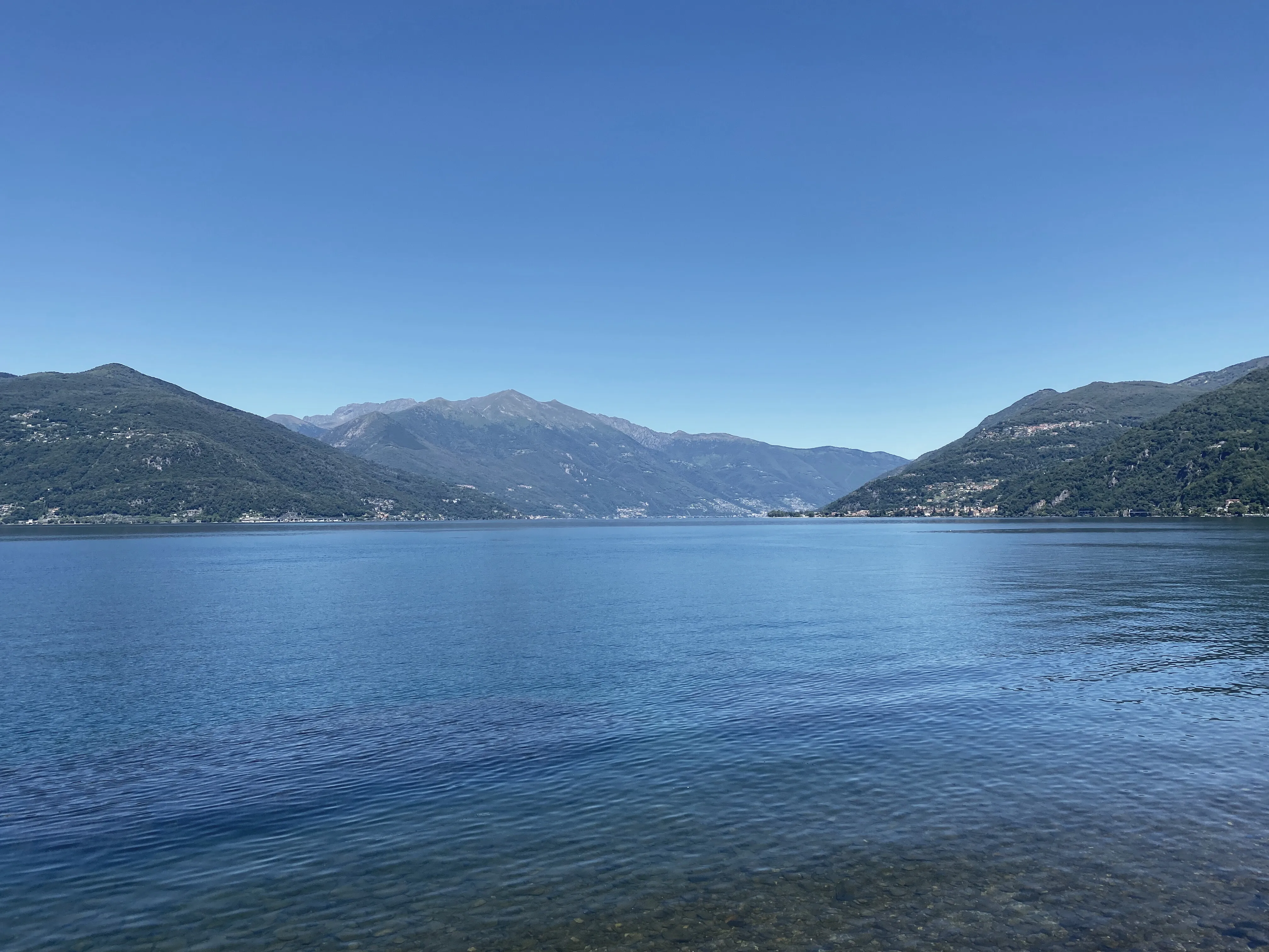 Lago Maggiore, flat water and the mountains on the far side.